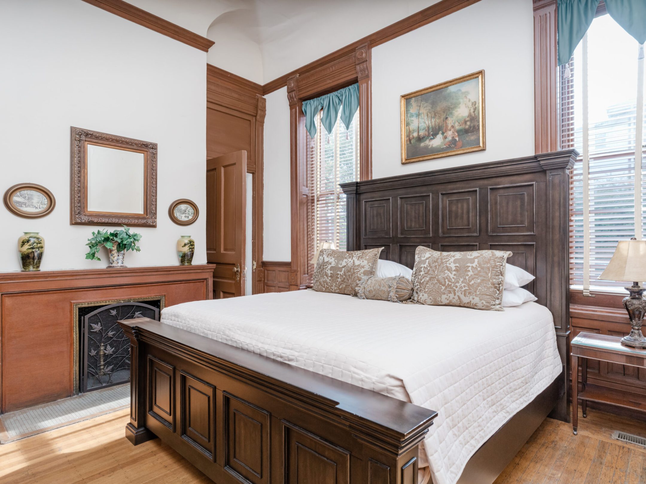 a bedroom with a large bed in a room