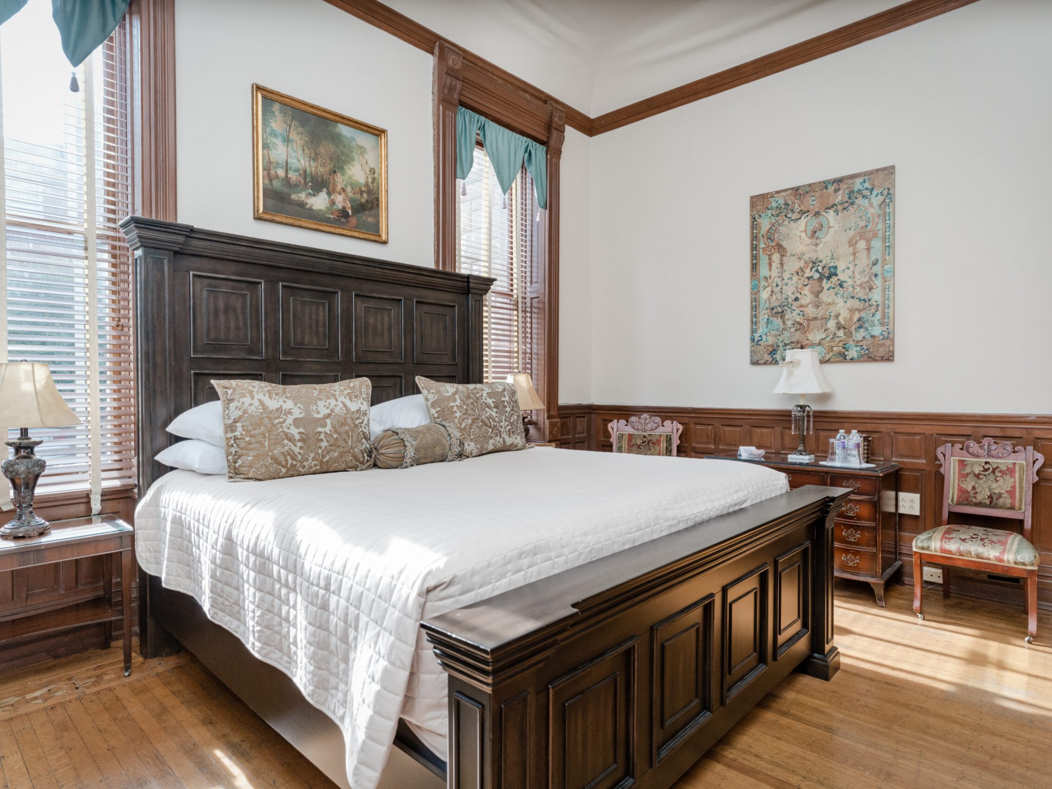 a bedroom with a large bed in a room