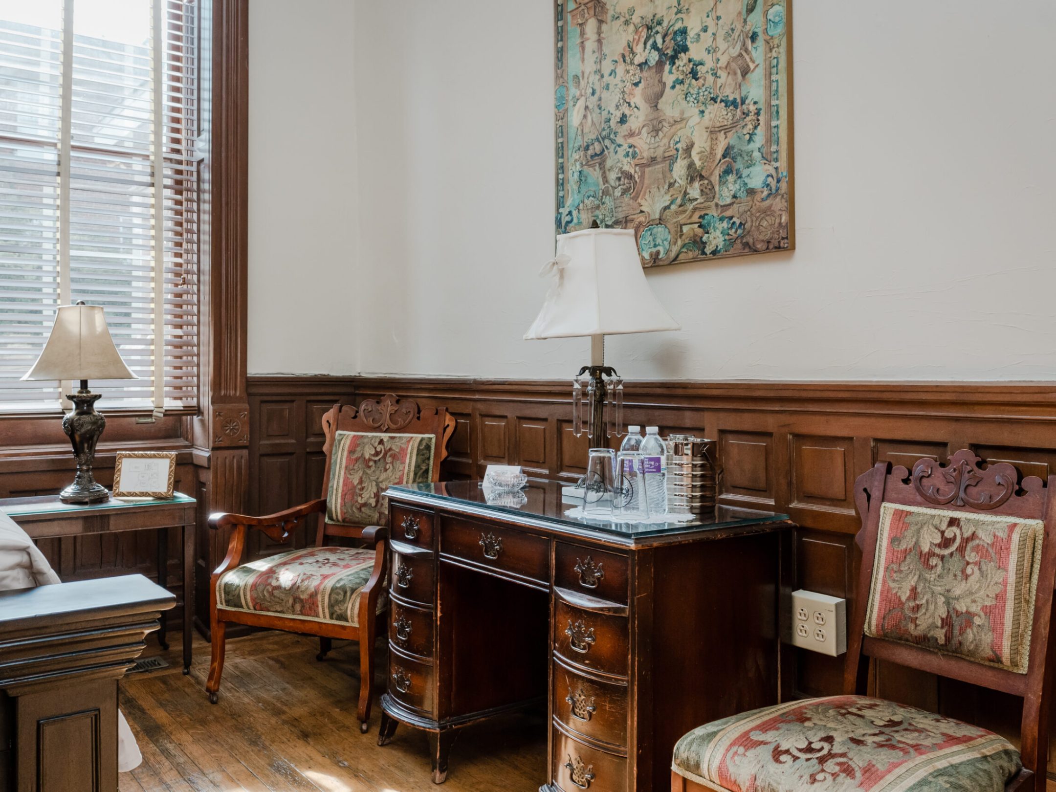 a living room filled with furniture and a large window