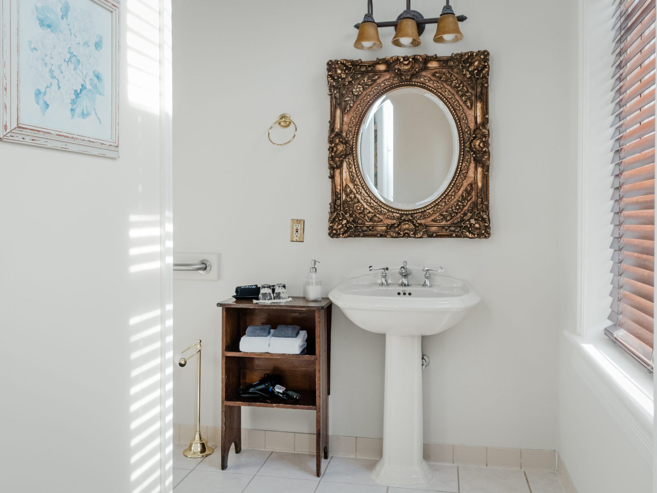 a room with a sink and a mirror