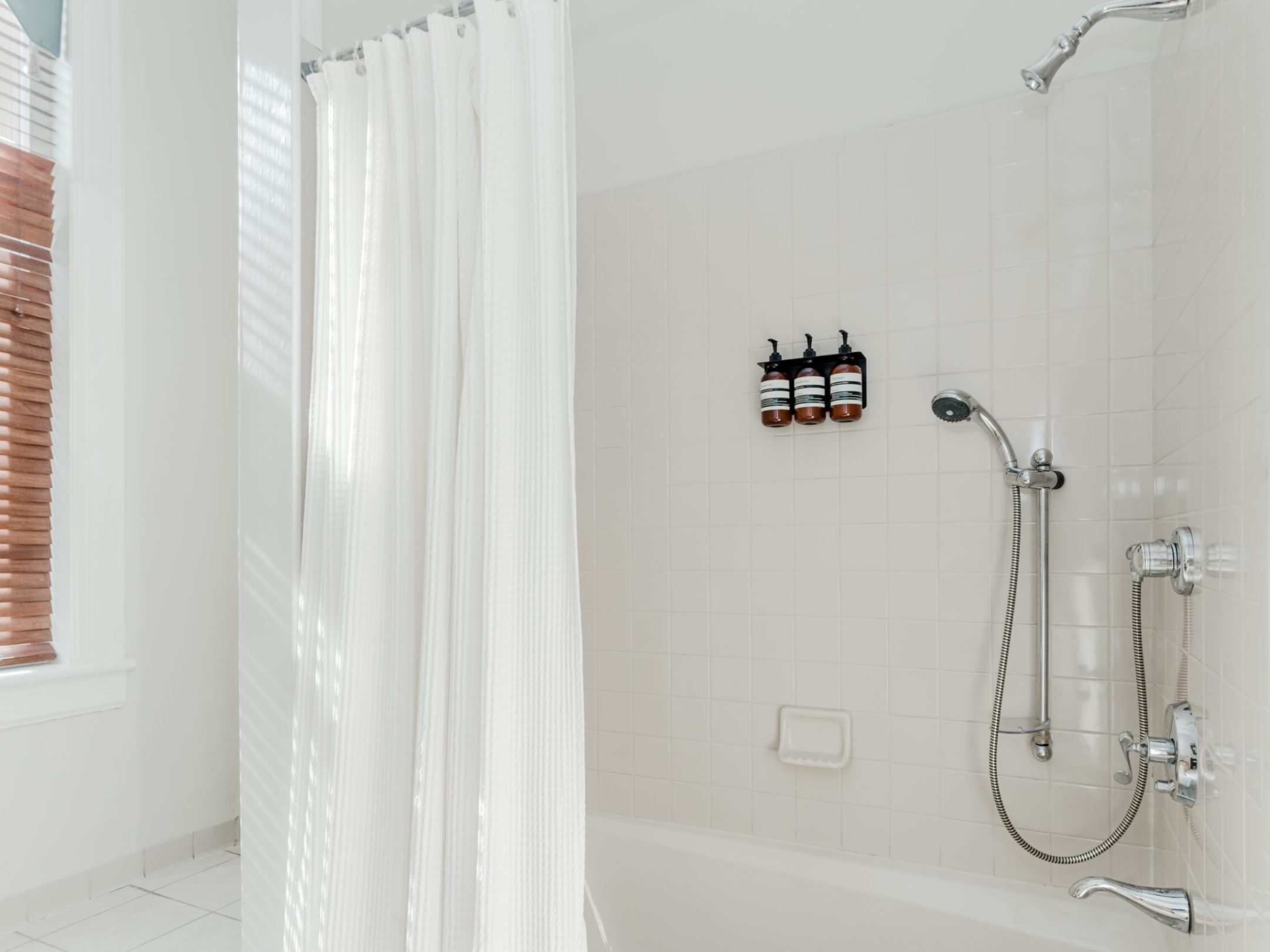 a shower curtain next to a window
