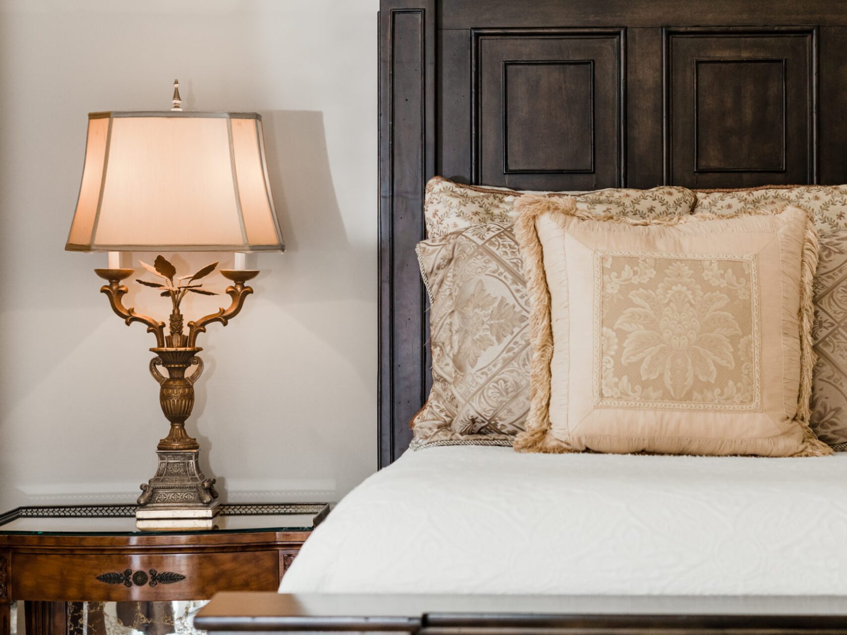 a bedroom with a bed and a mirror