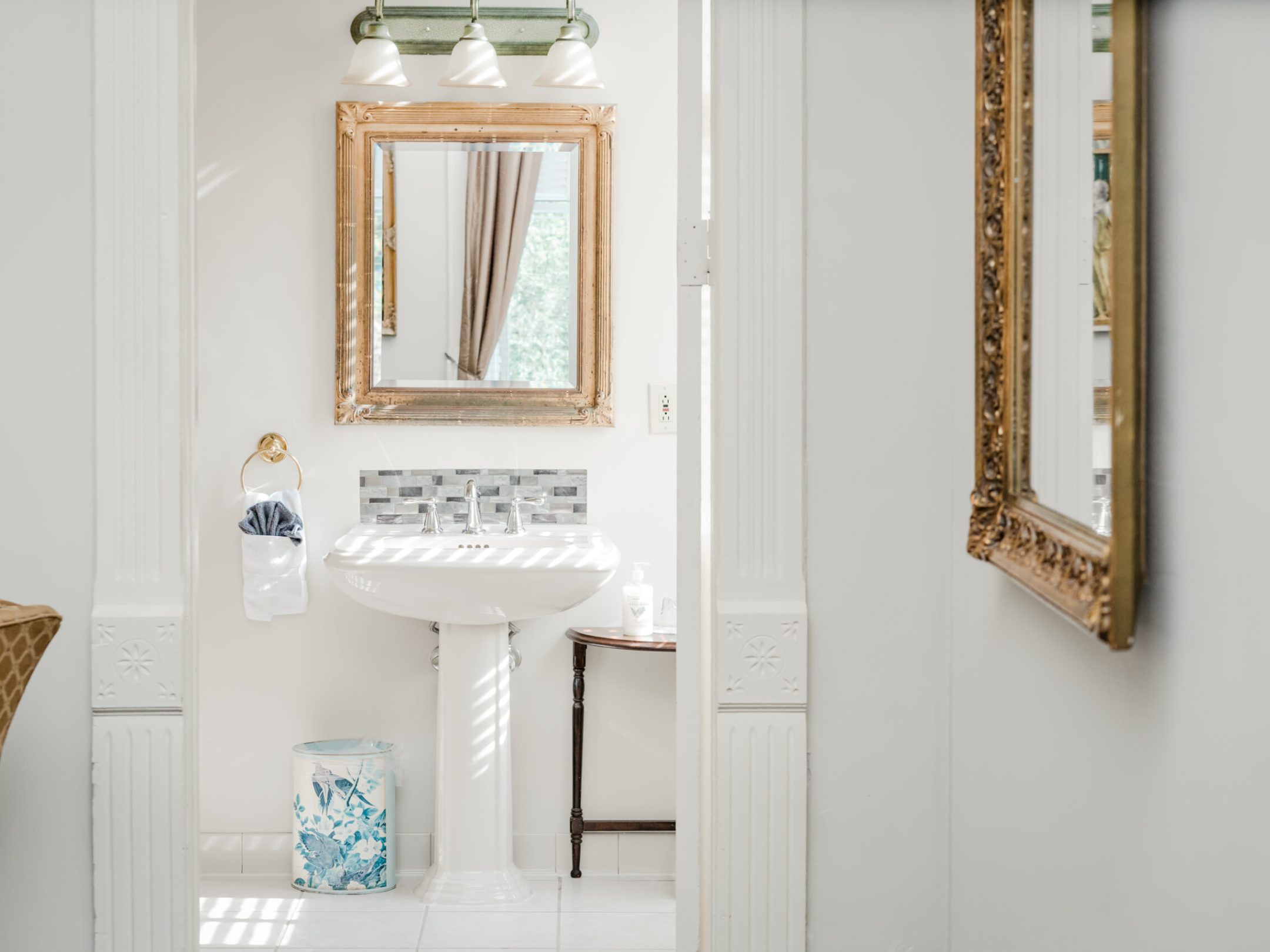 a room with a sink and a mirror