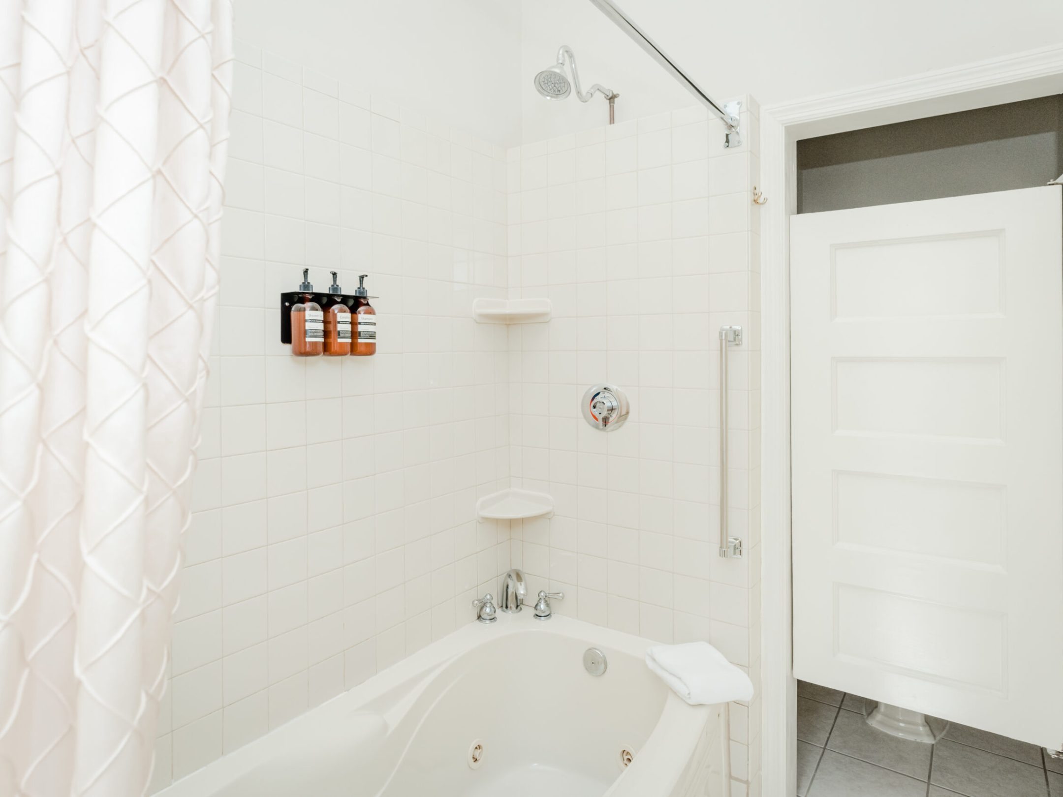 a room with a sink and a mirror