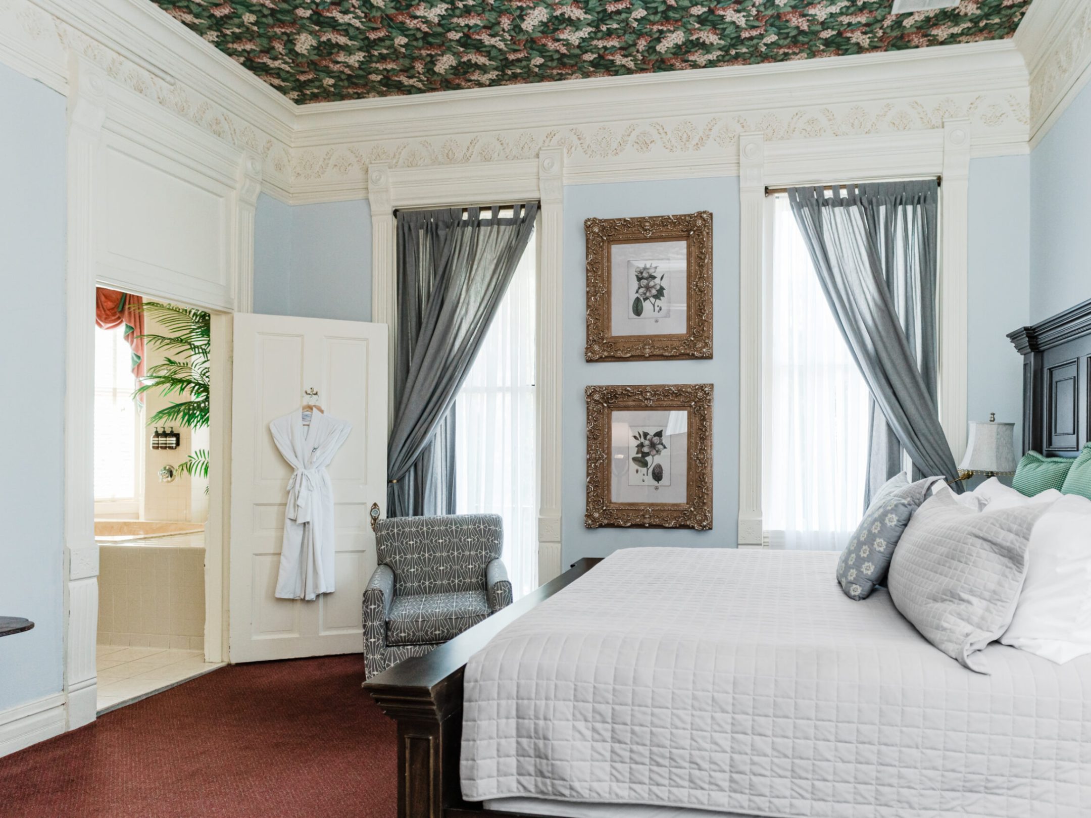 a bedroom with a large bed in a room