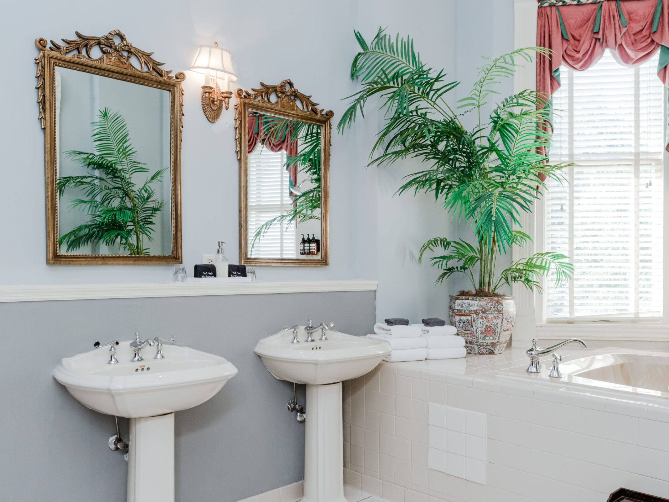 a room with a sink and a mirror