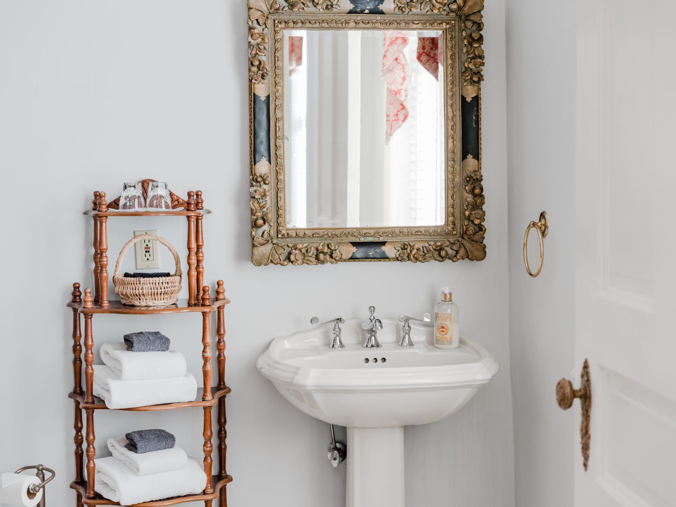a room with a sink and a mirror