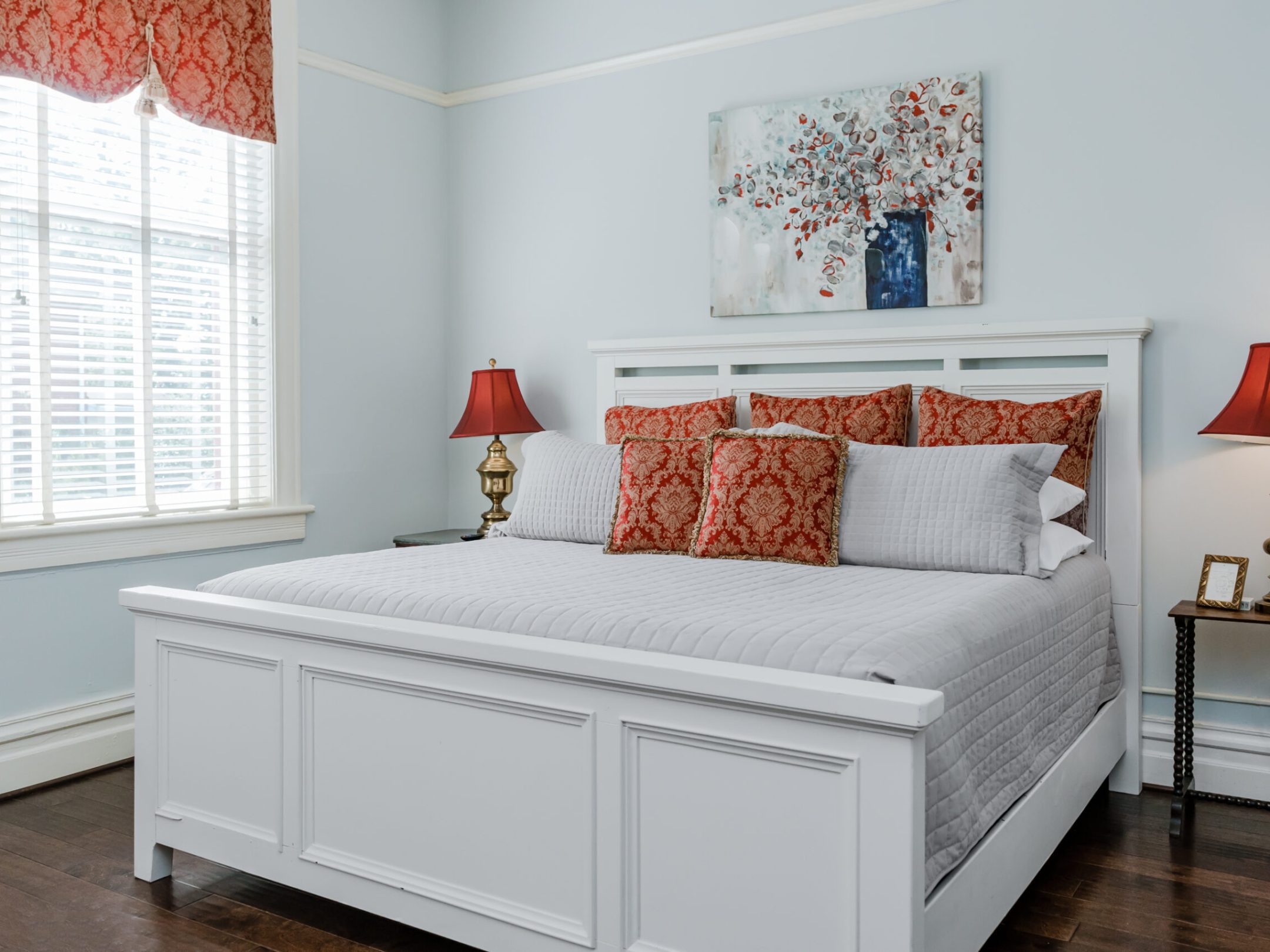 a bedroom with a bed in a room