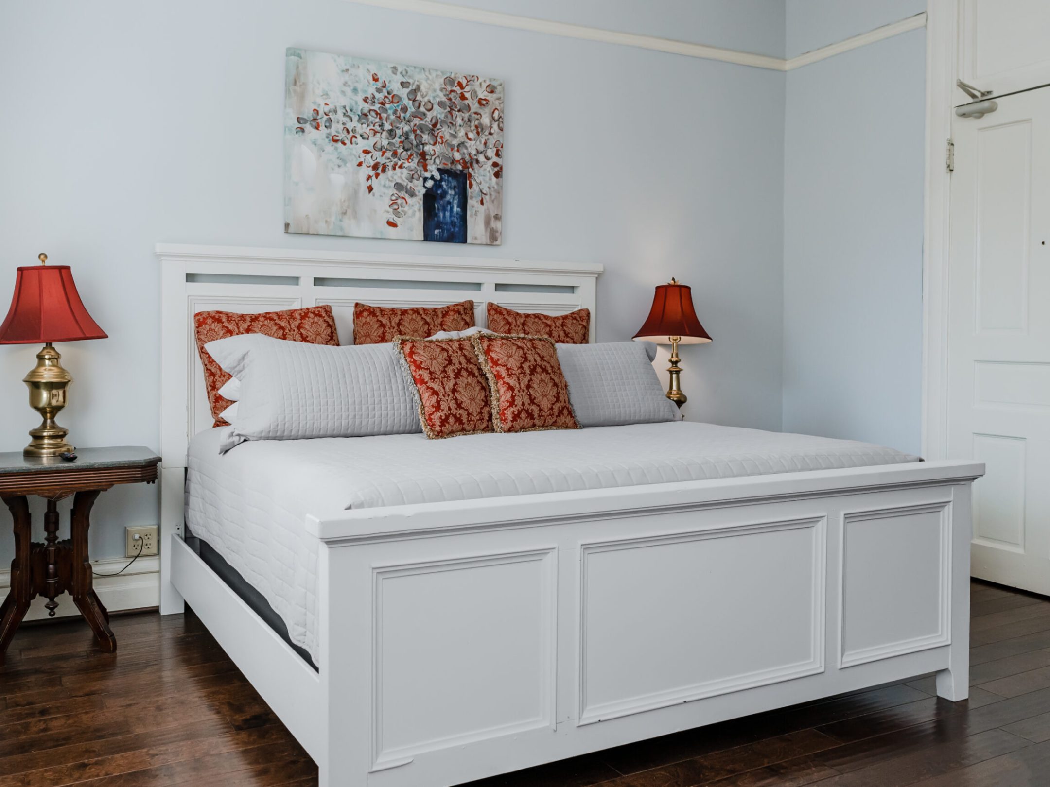 a bedroom with a bed in a room
