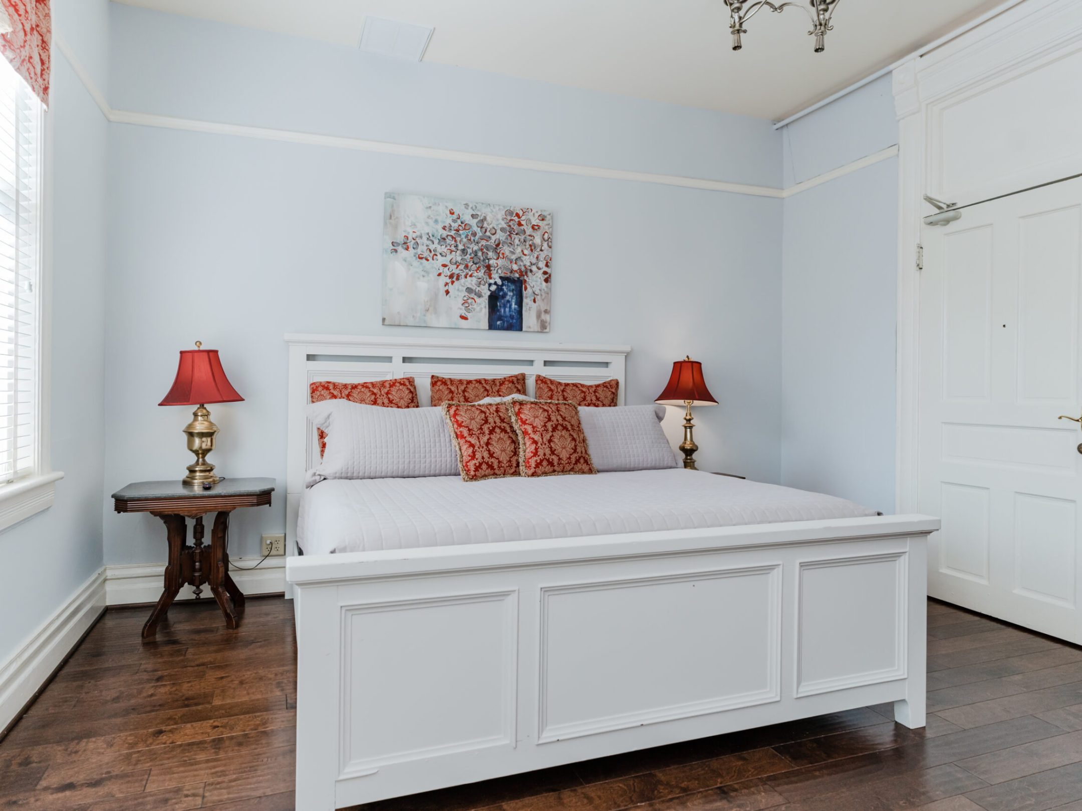 a bedroom with a large mirror