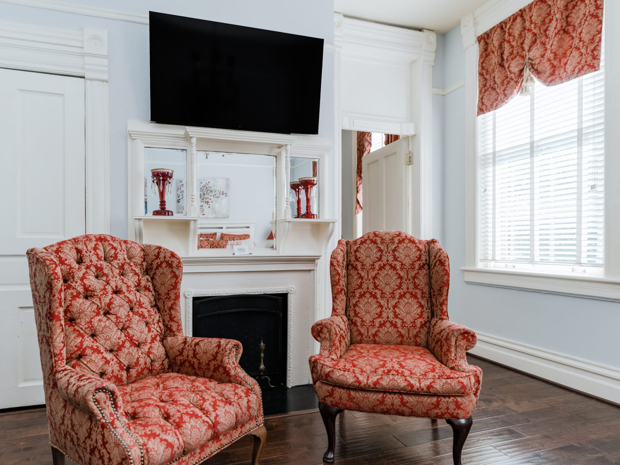 a living room filled with furniture and a large window