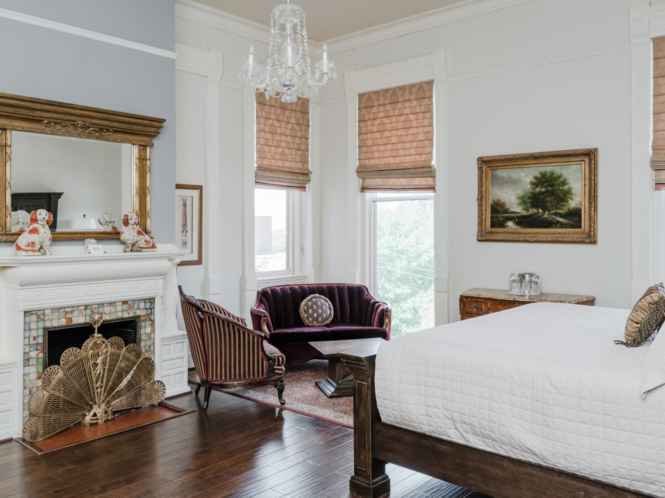 a bedroom with a bed and a fireplace