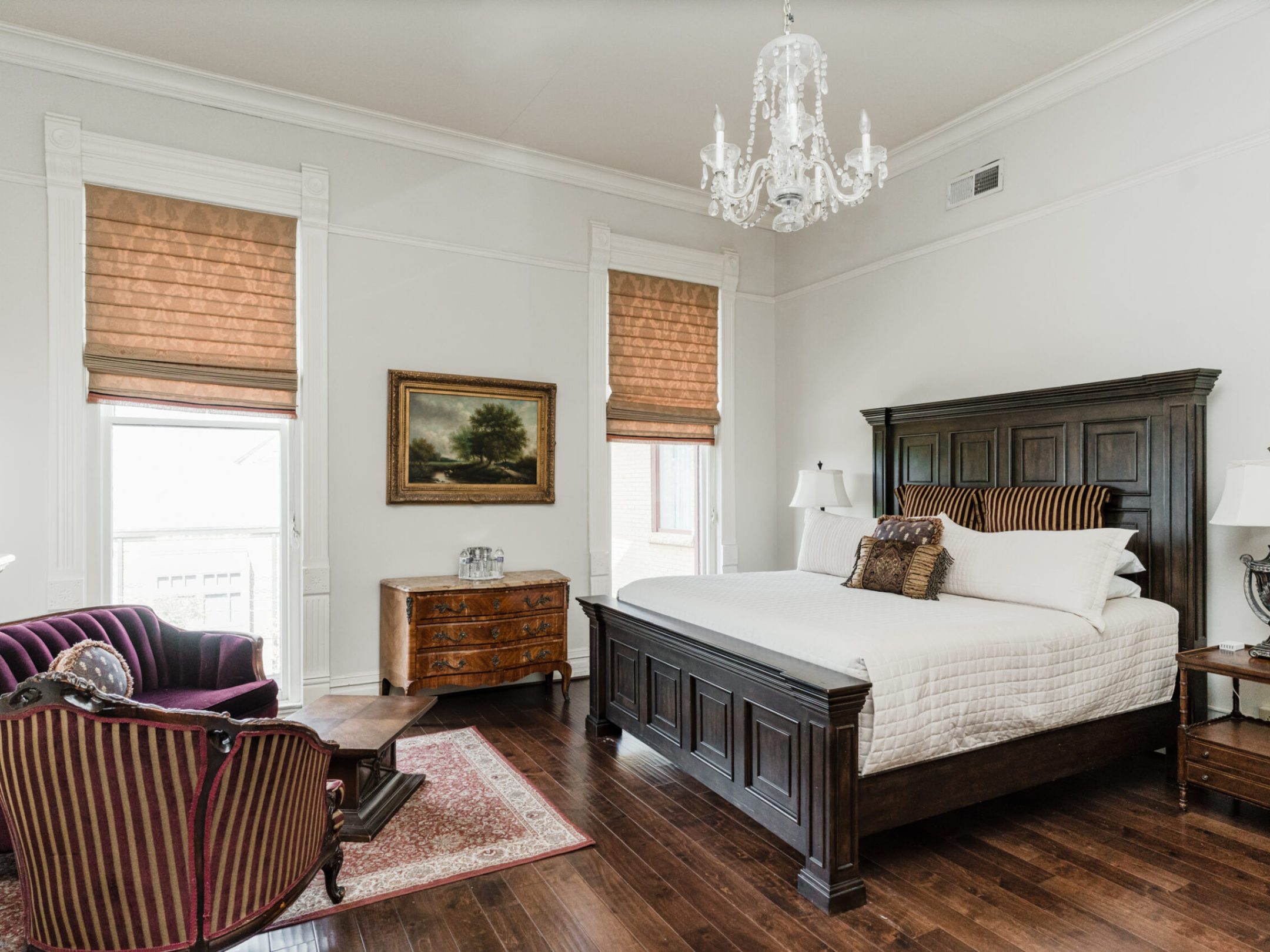 a living room with a bed and a fireplace