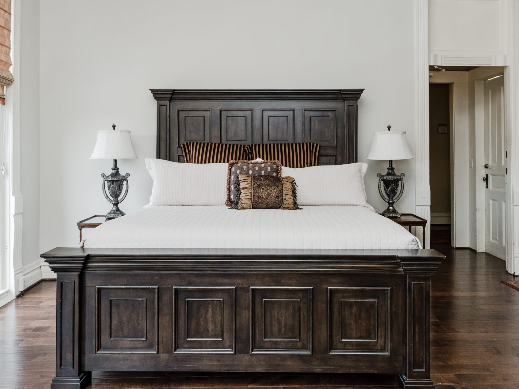 a bedroom with a wooden door