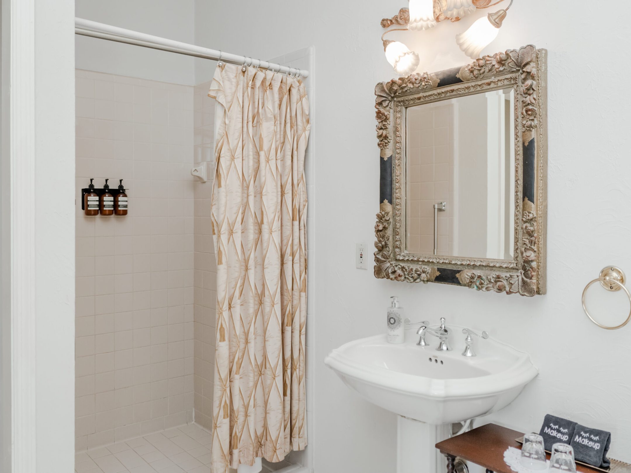 a room with a sink and a mirror