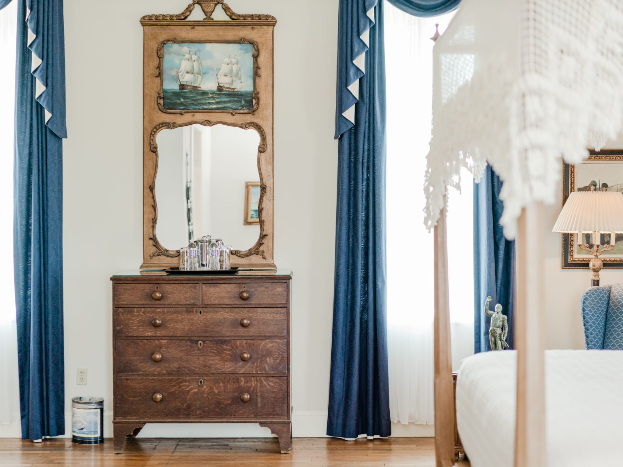 a bedroom with a bed and a mirror