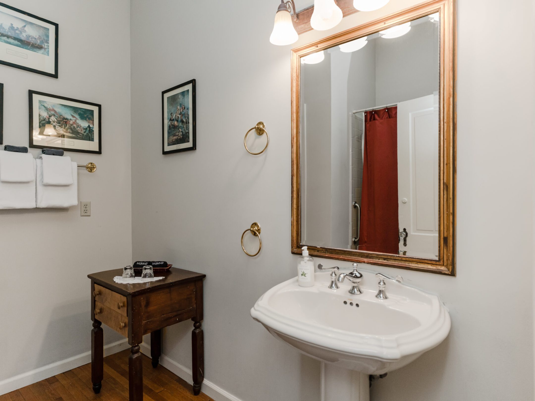 a room with a sink and a mirror
