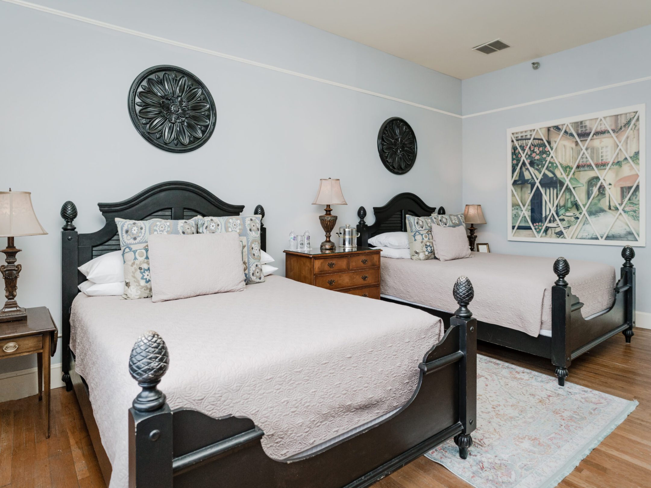 a living room filled with furniture and a mirror