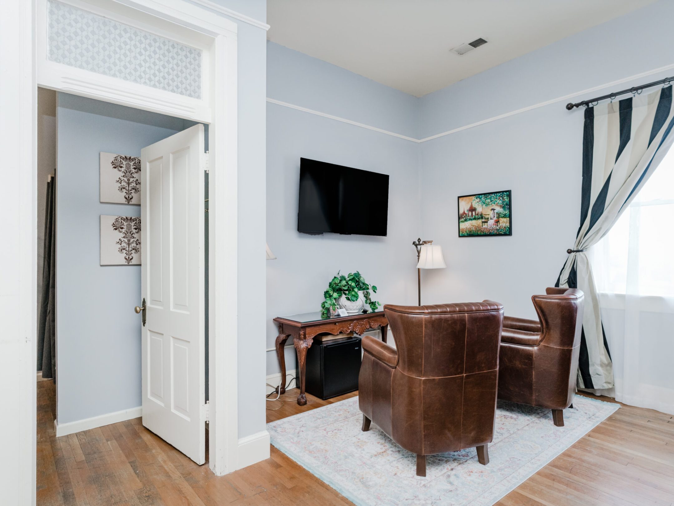 a living room filled with furniture and a fireplace