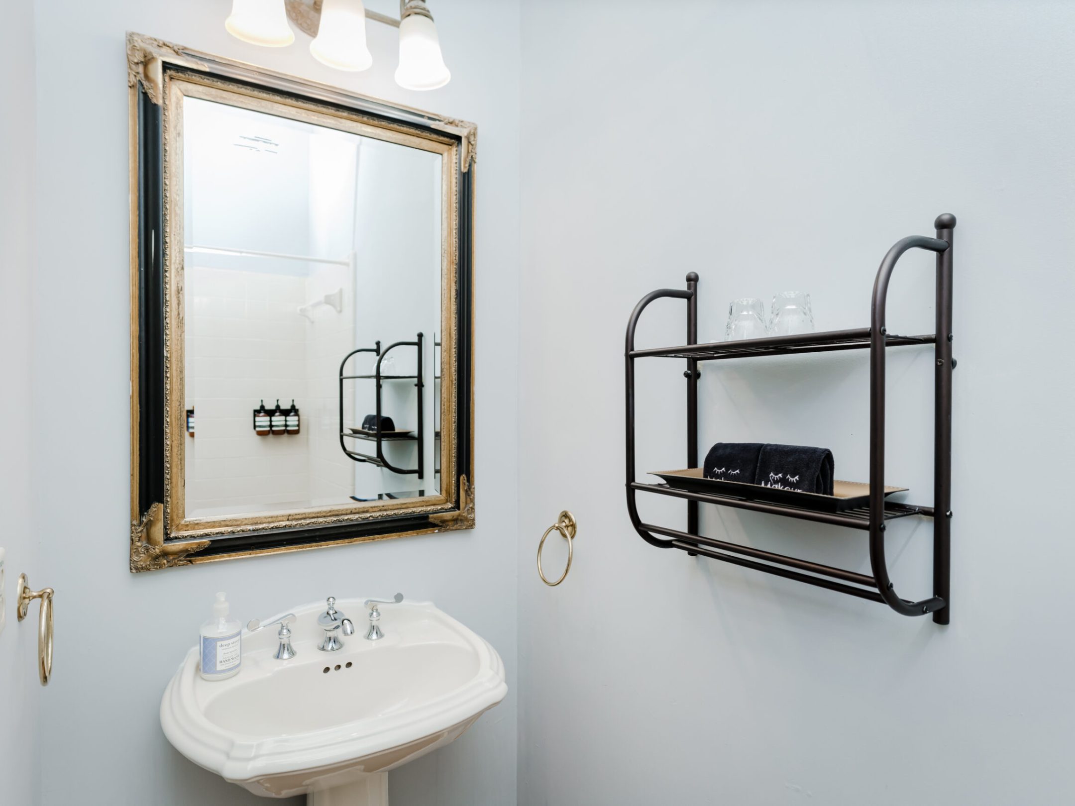 a room with a sink and a mirror