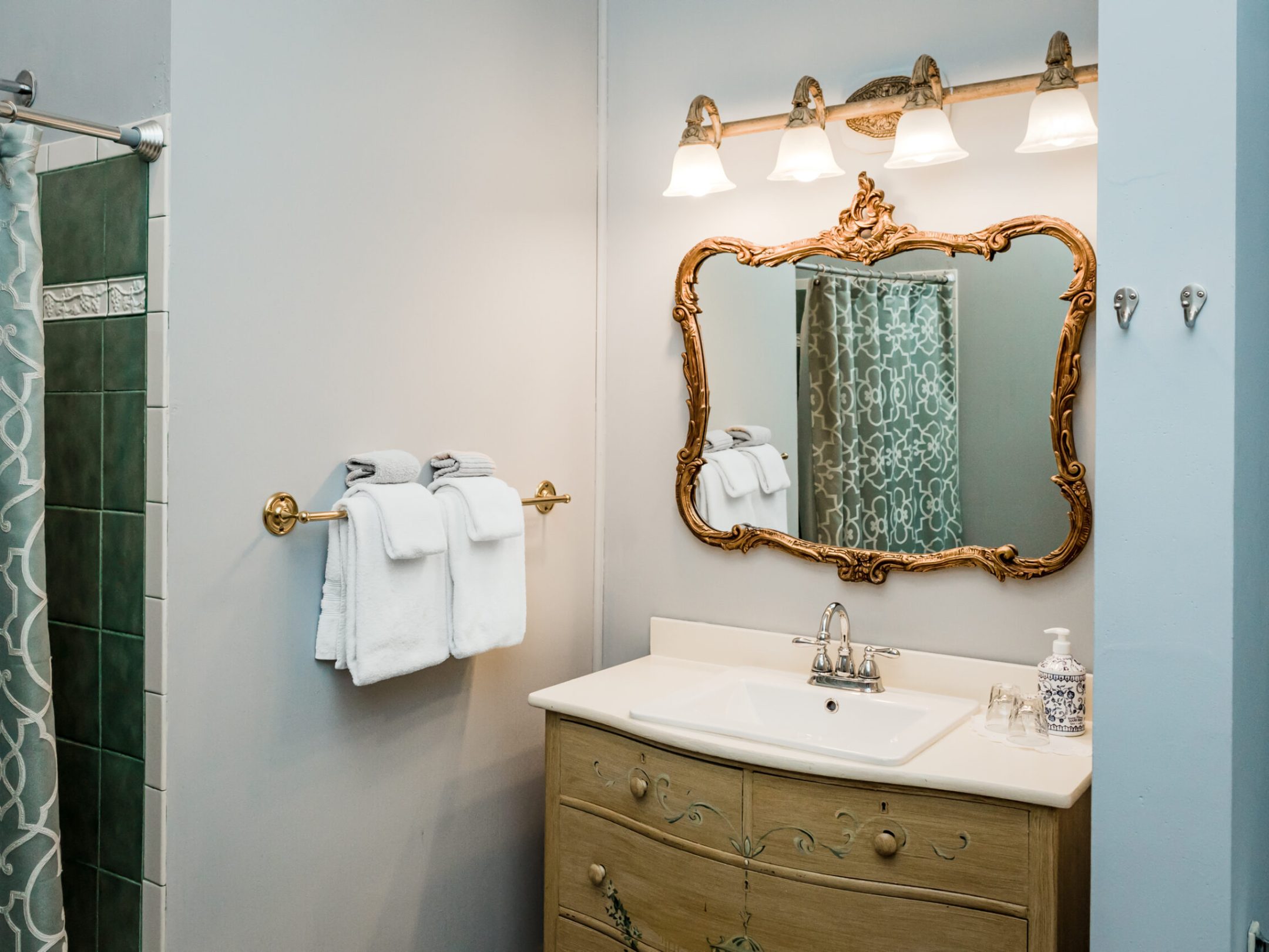 a room with a sink and a mirror