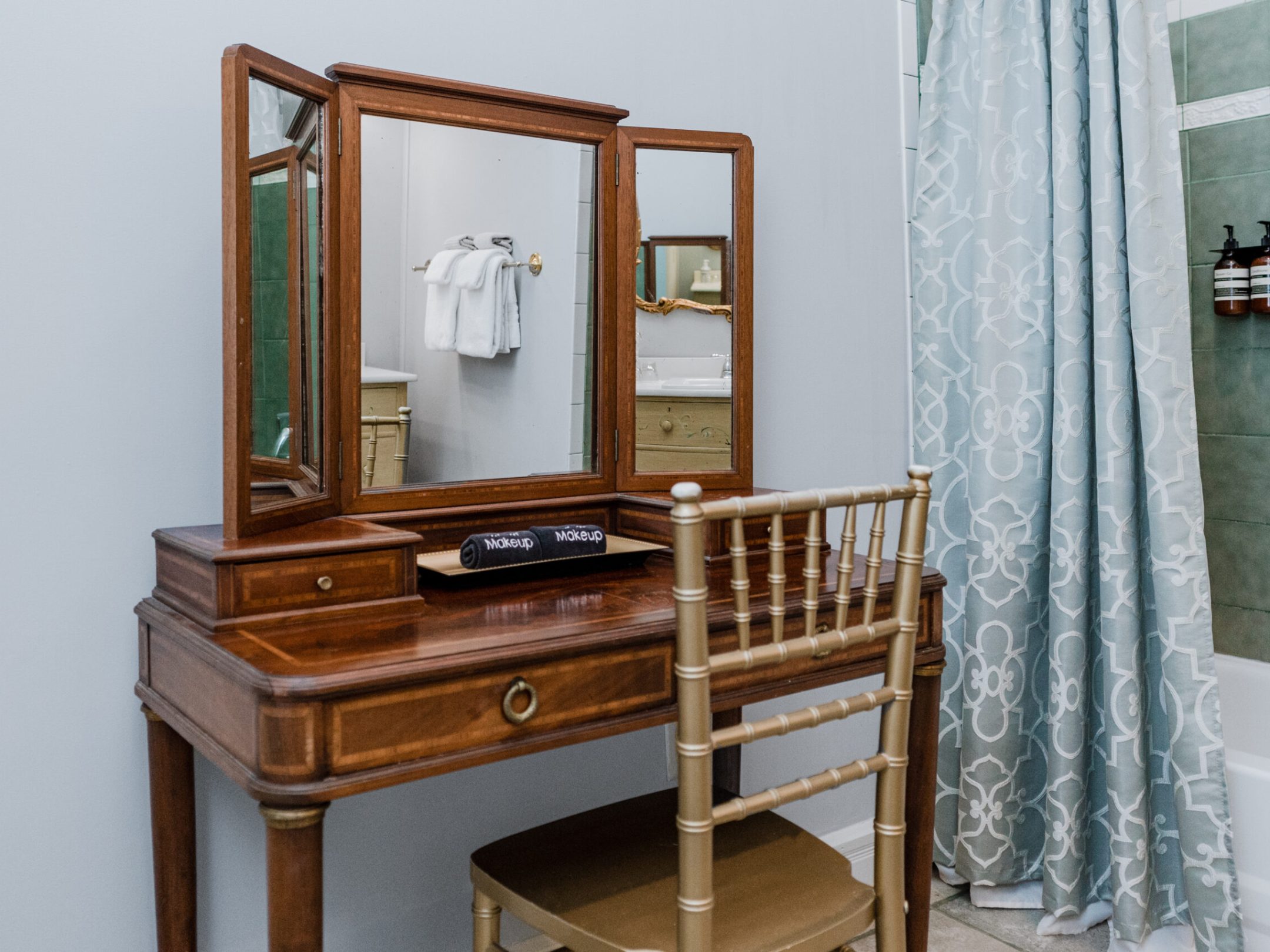 a chair sitting in front of a mirror posing for the camera