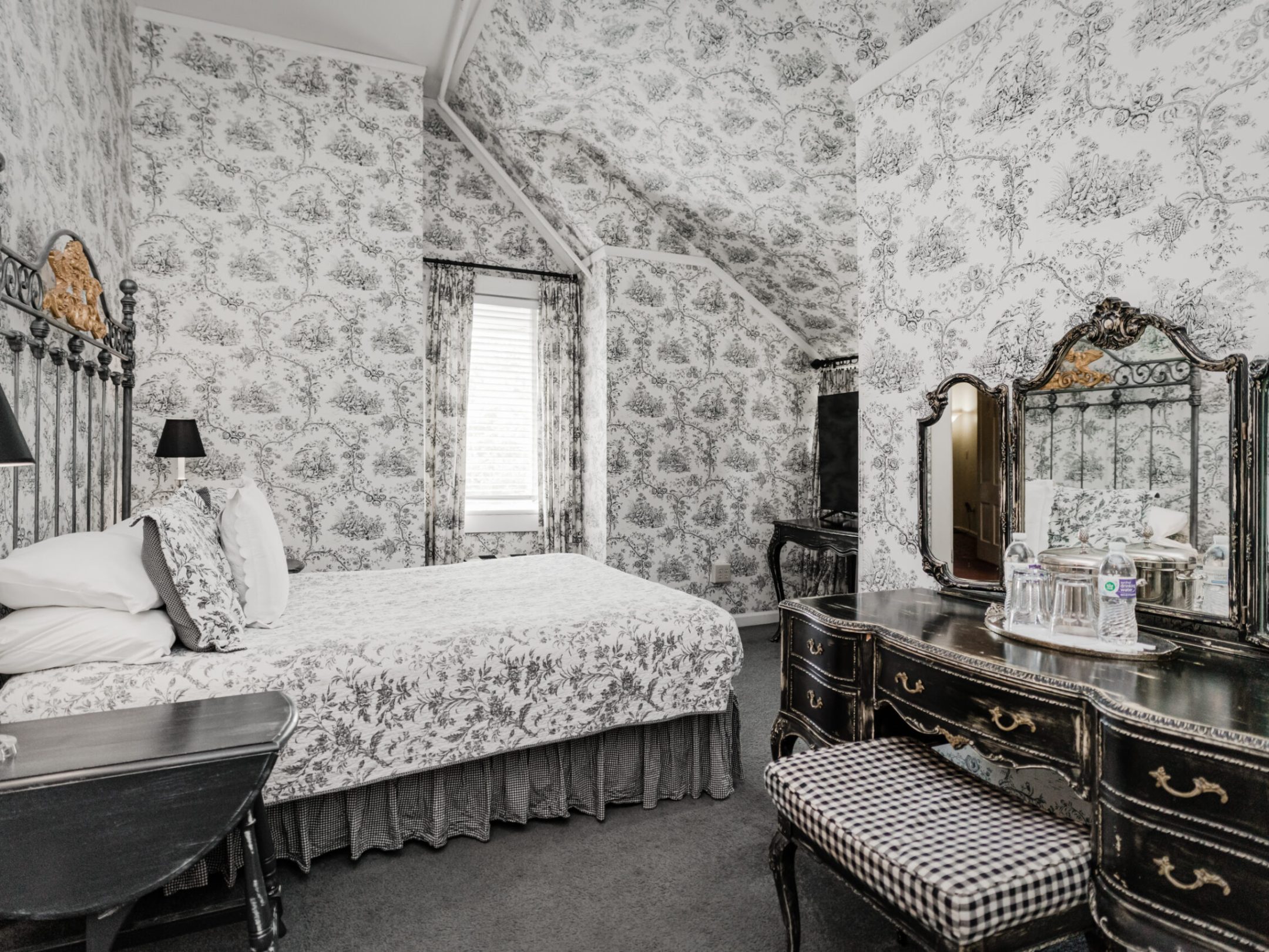 a bedroom with a bed and a fireplace
