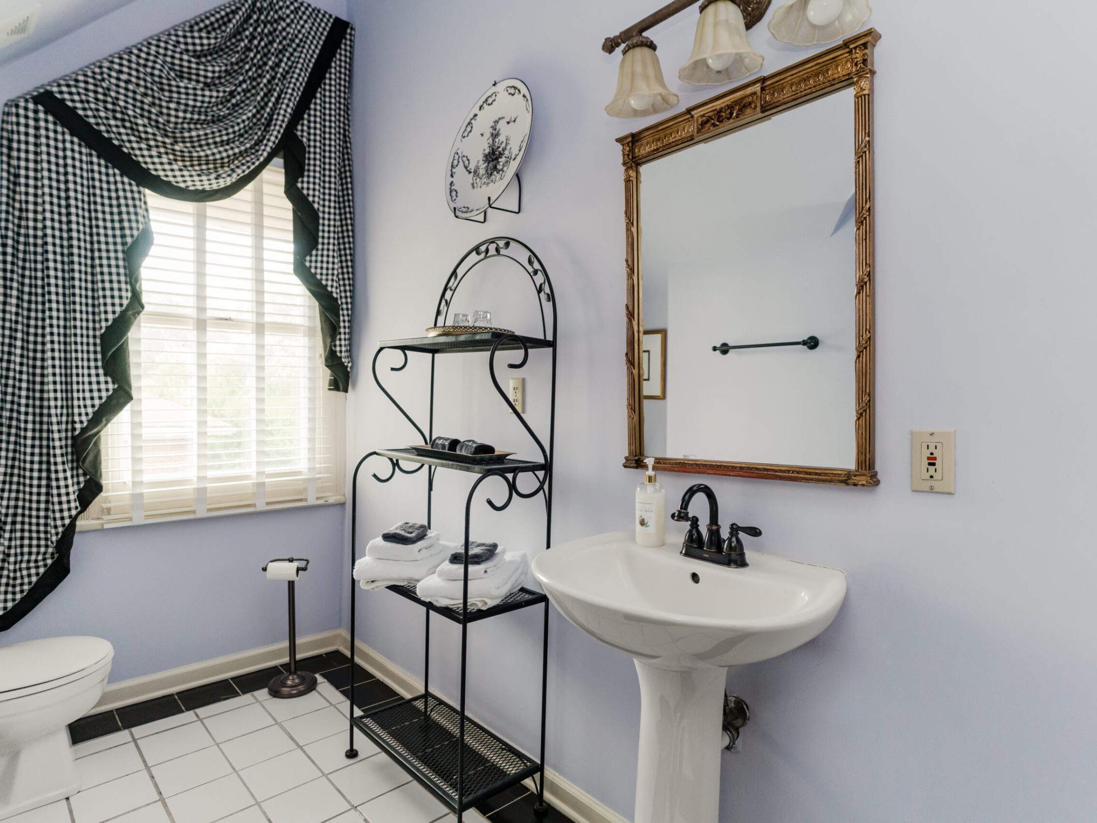 a room with a sink and a mirror