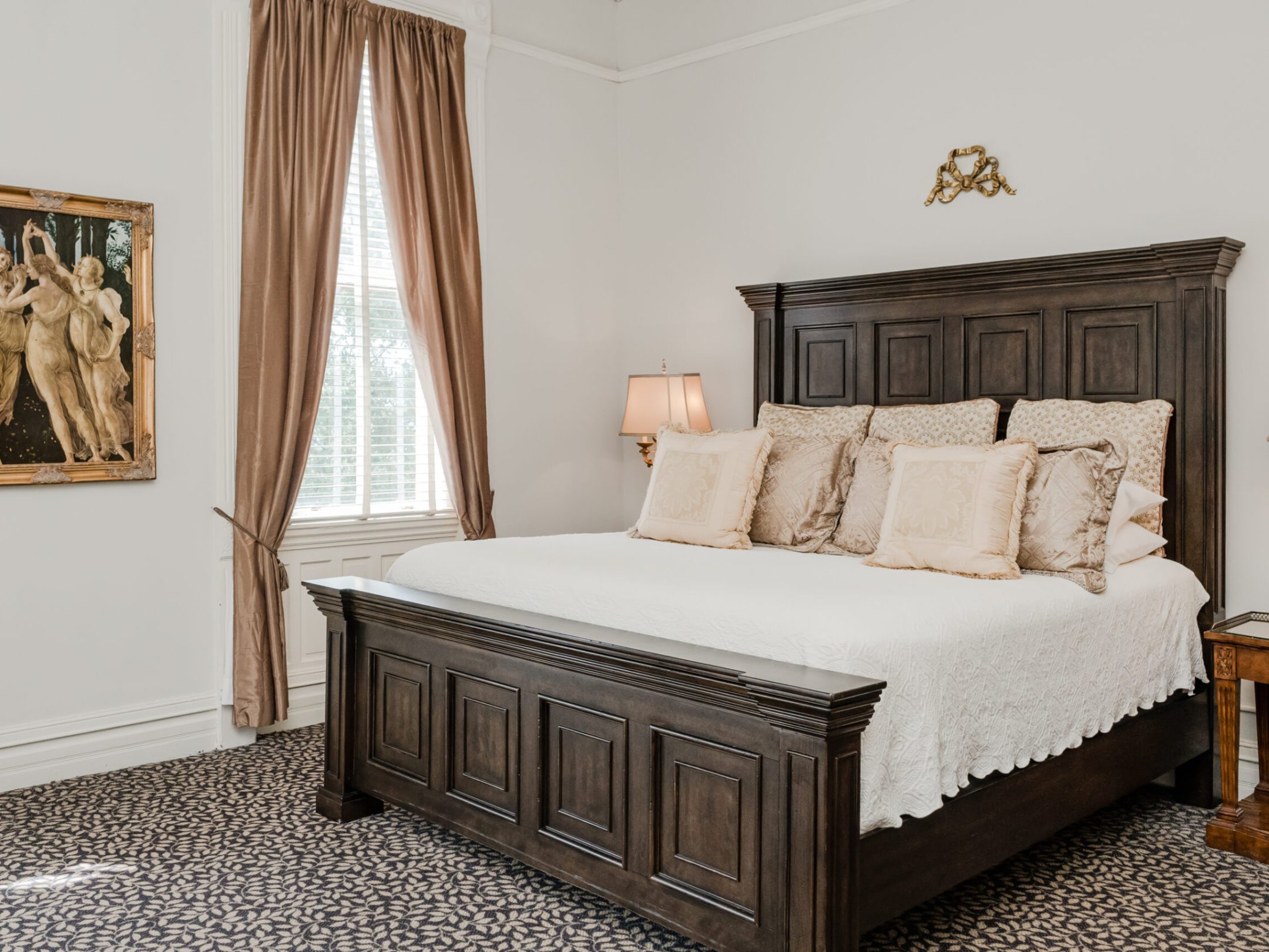 a bedroom with a bed in a room