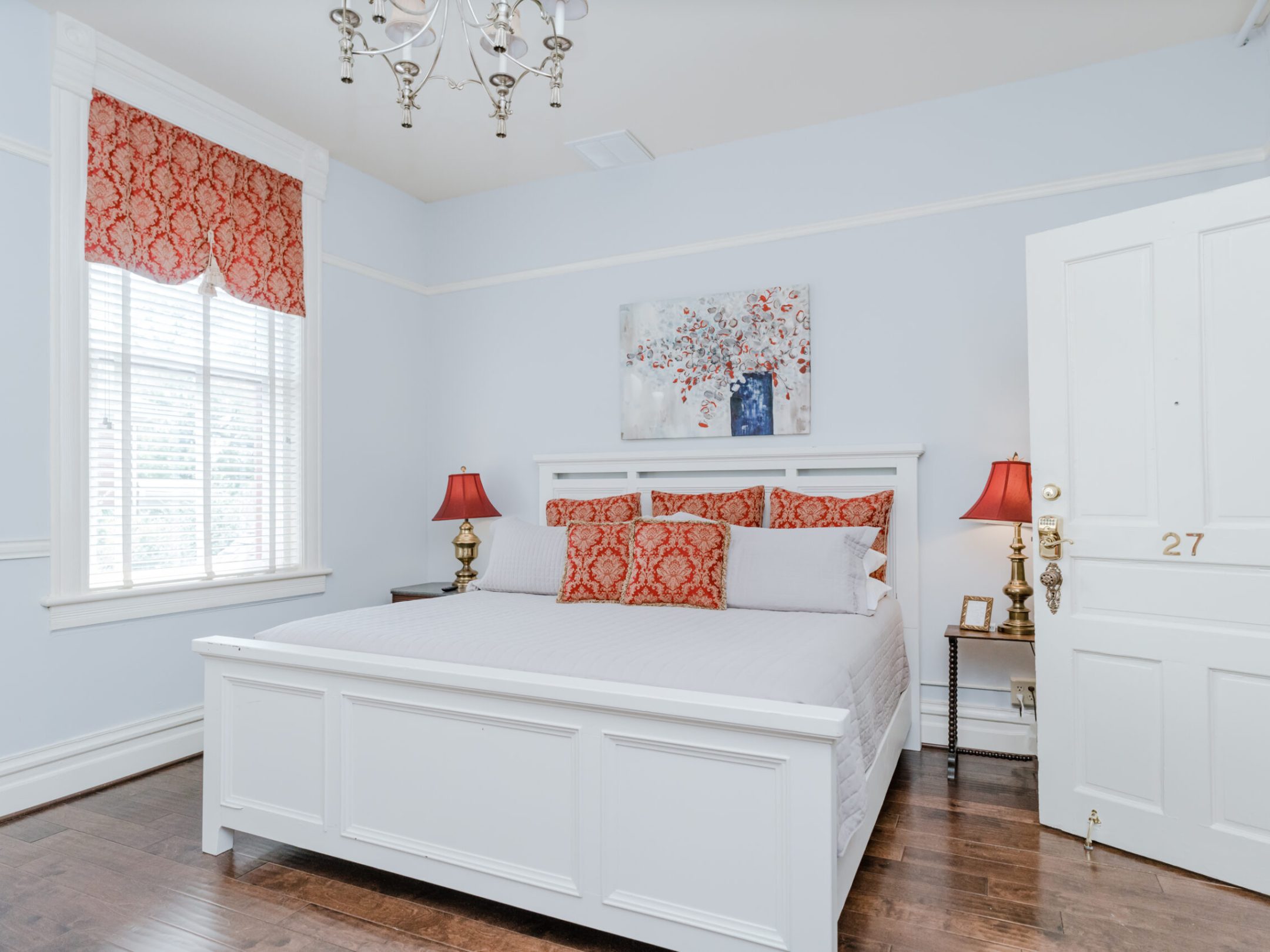 a bedroom with a large mirror