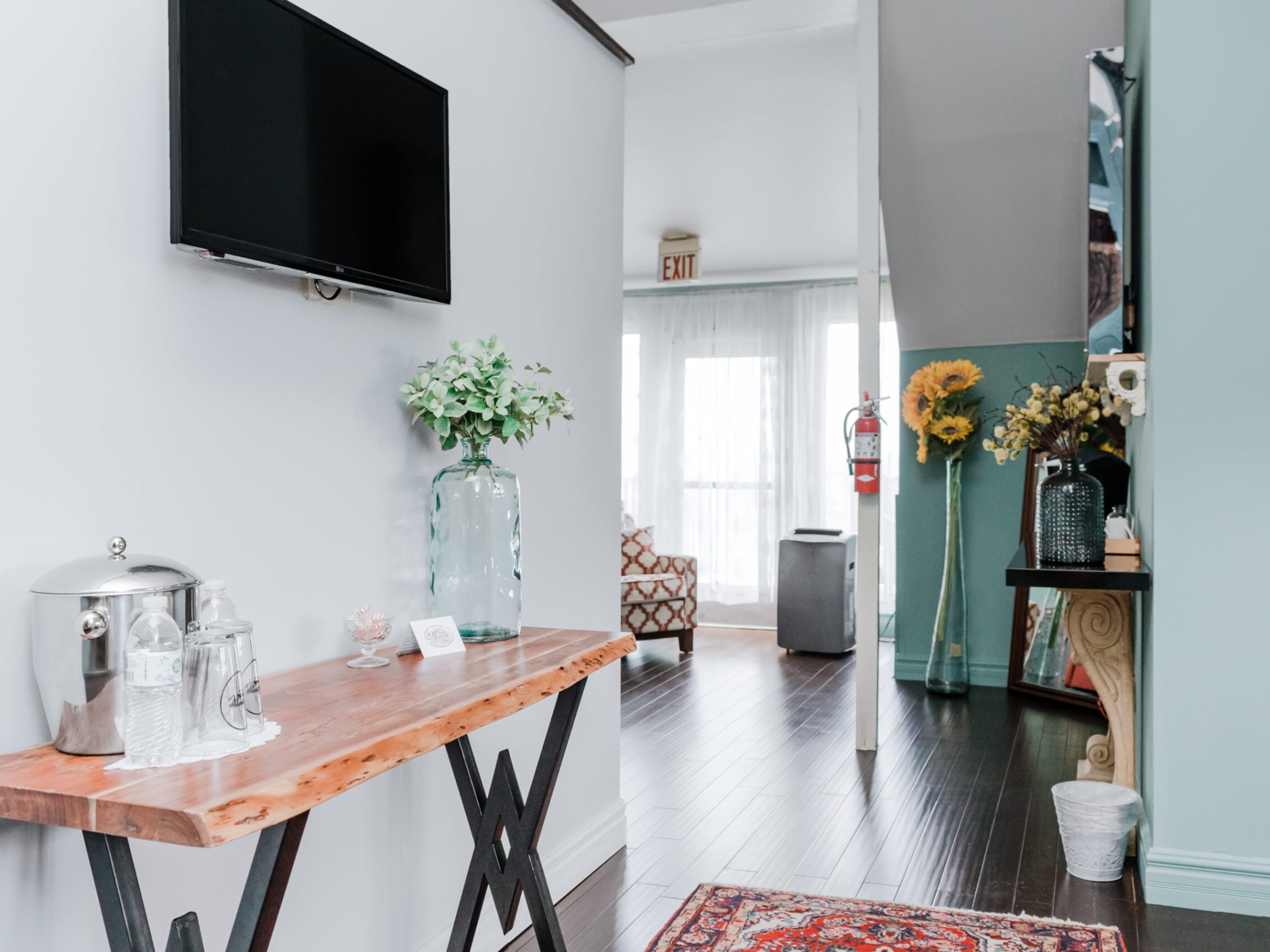 a room filled with furniture and a mirror
