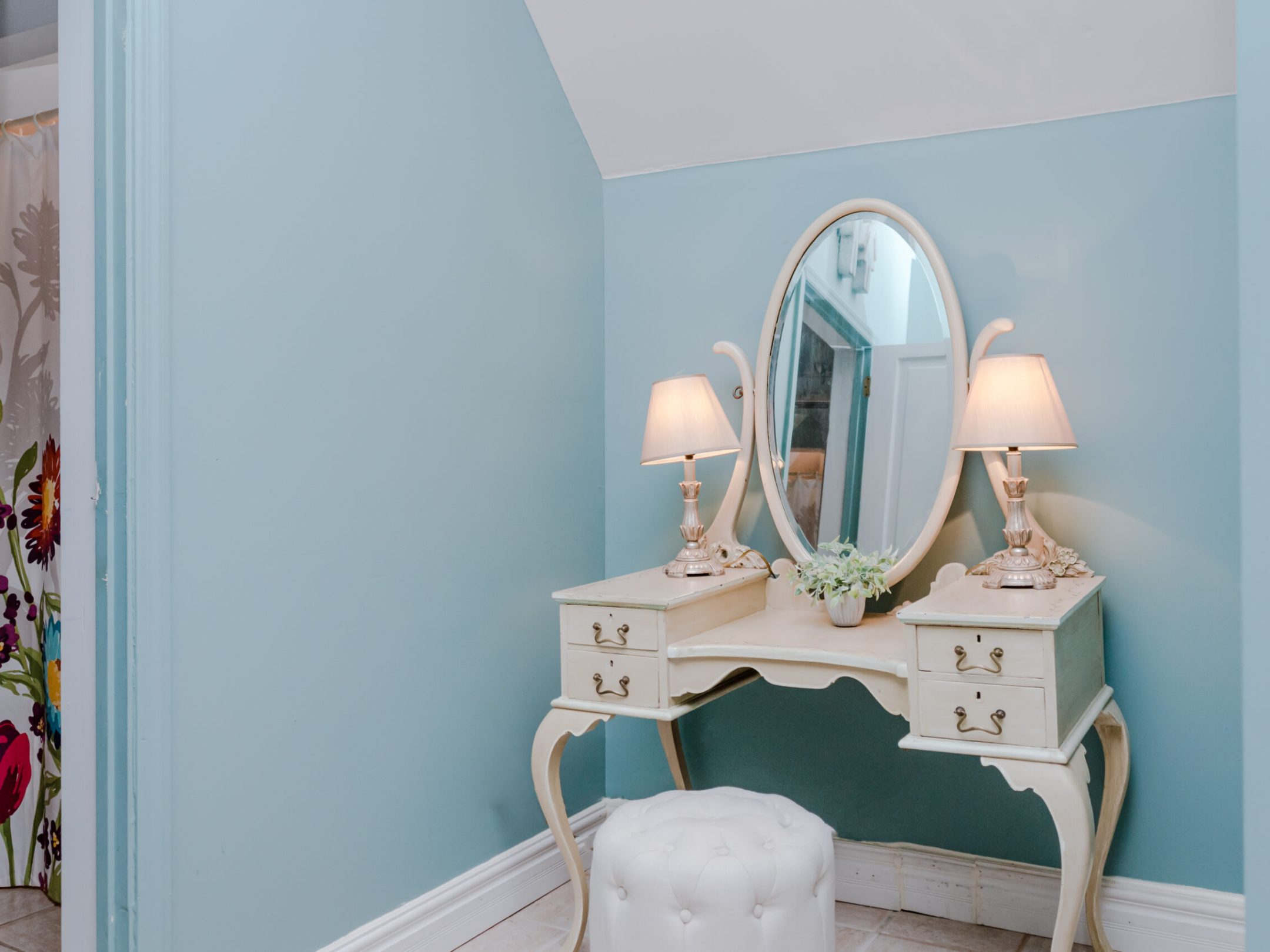 a bedroom with a bed and a mirror