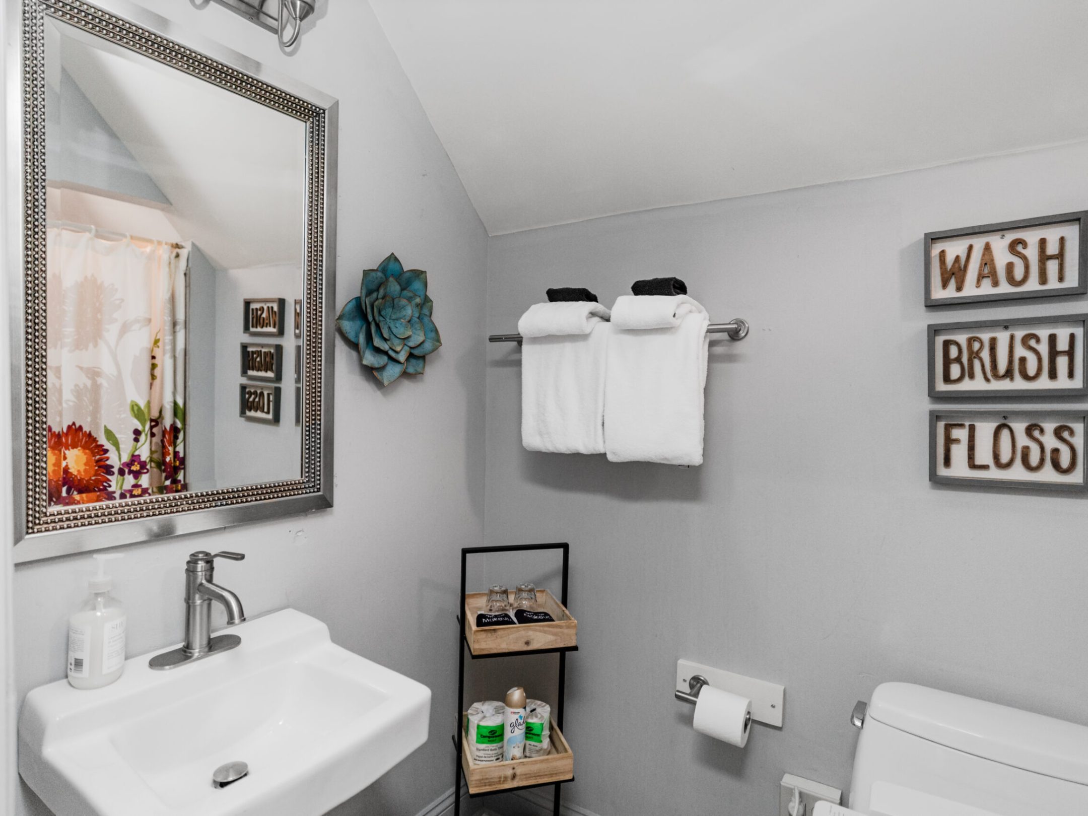 a room with a sink and a mirror