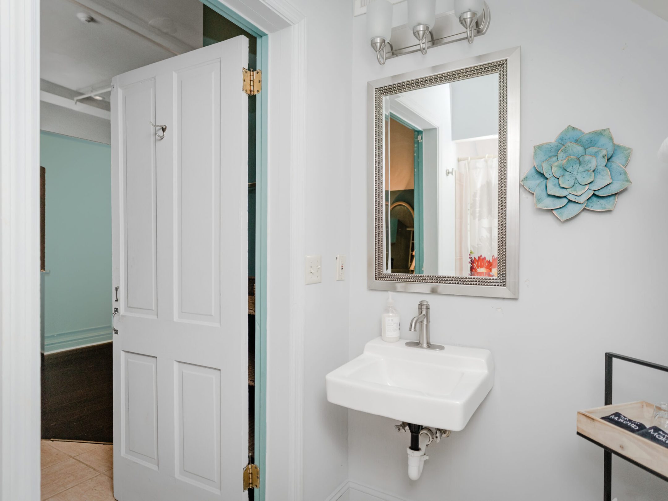 a room with a sink and a mirror