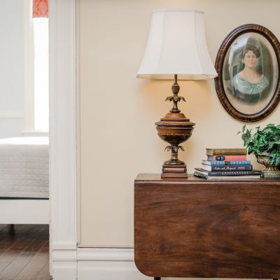 a room filled with furniture and vase on a table