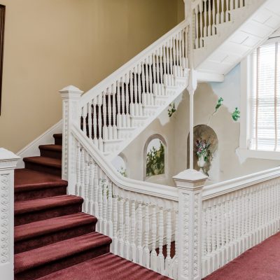 a room filled with furniture and a large window