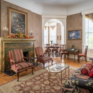 a living room filled with furniture and a fire place