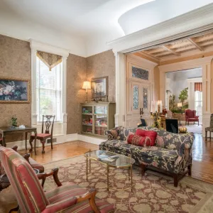 a living room filled with furniture and a fire place