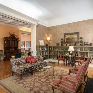 a living room filled with furniture and a fire place