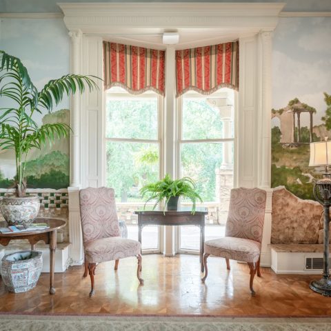 a living room filled with furniture and a fire place