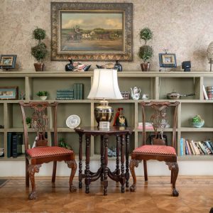 a living room filled with furniture and a fireplace
