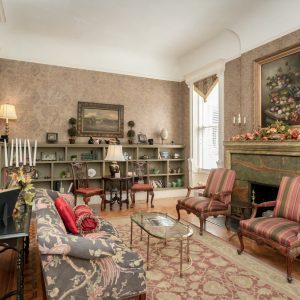 a living room filled with furniture and a fire place