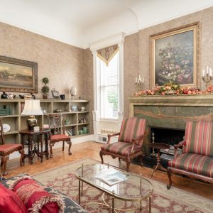 a living room filled with furniture and a fire place