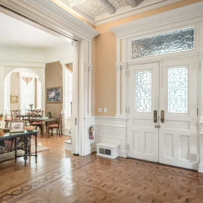 a living room filled with furniture and a large window