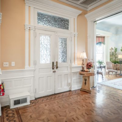 a living room filled with furniture and a large window