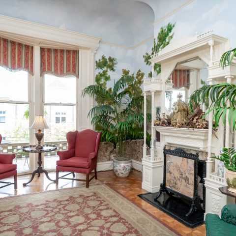 a living room filled with furniture and a fire place