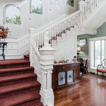 a living room filled with furniture and a fireplace