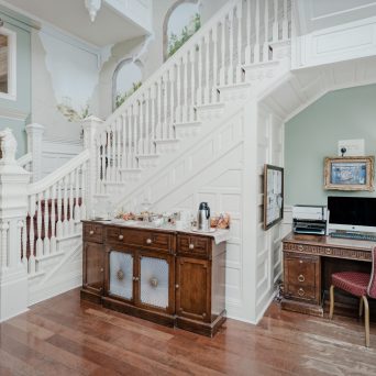 a living room filled with furniture and a fireplace