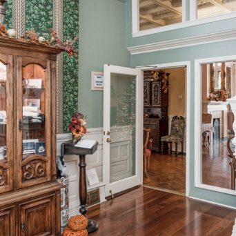 a room filled with furniture and a large window