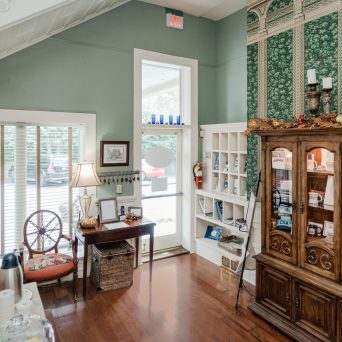 a room filled with furniture and a large window